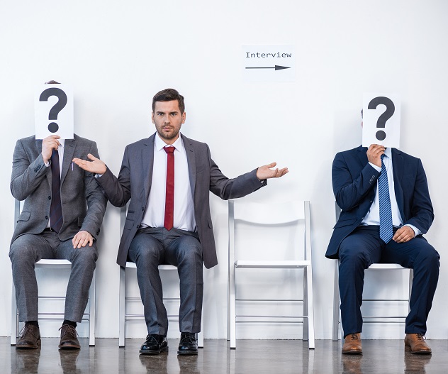 businesspeople sitting in queue and waiting for interview, holding question marks in office,